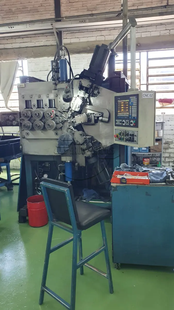 LOTE 005 - **Máquina de enrolar molas