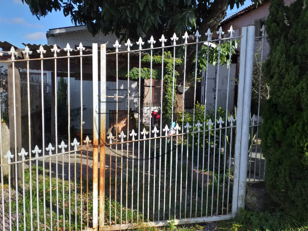 LOTE 009 - Um terreno urbano c/ benfeitorias em Alvorada/RS - Bairro Três Figueiras (POSSIBILIDADE DE PARCELAMENTO)